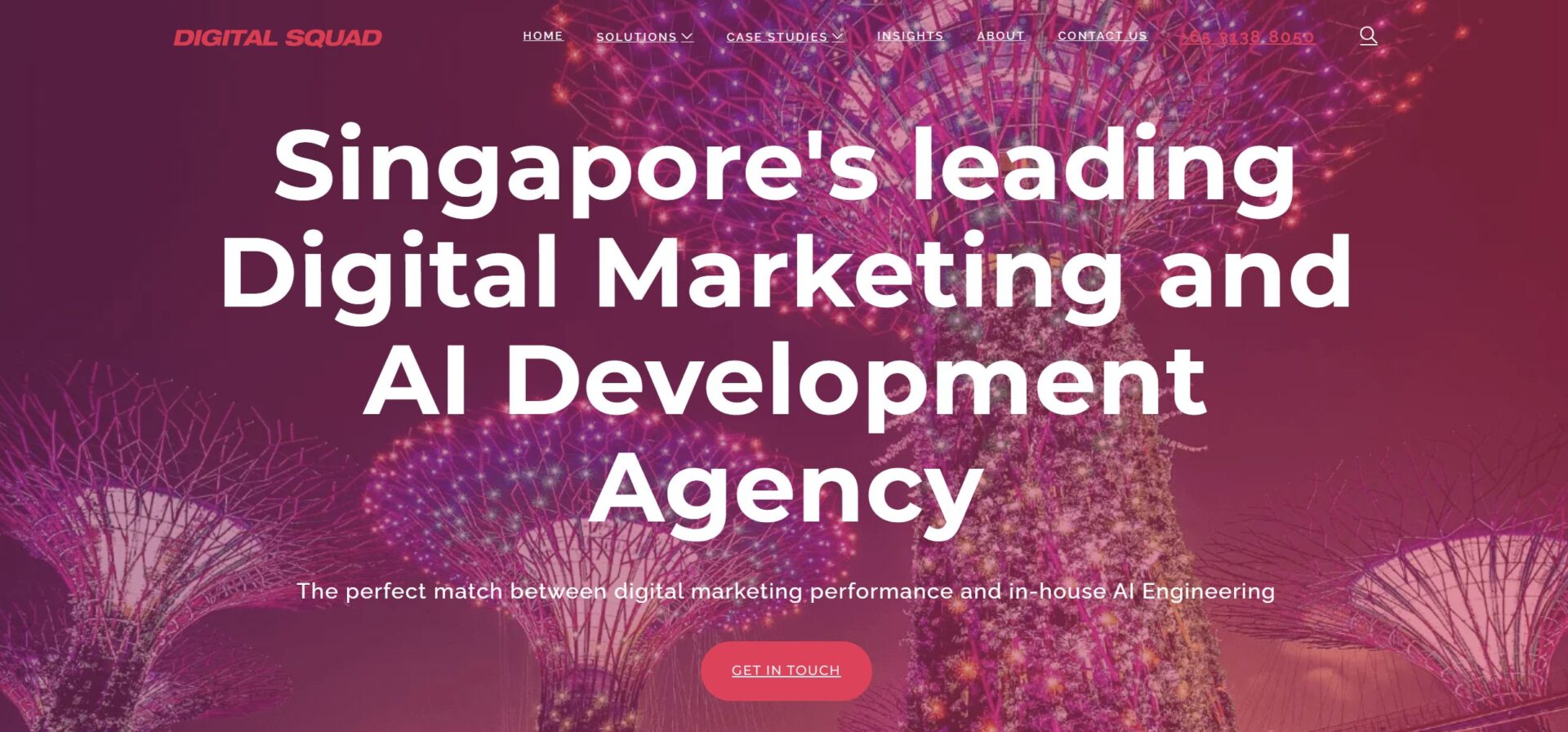 Digital Squad homepage featuring the headline Singapore's leading Digital Marketing and AI Development Agency over a purple-tinted background of the Gardens by the Bay supertrees with a red Get In Touch button.