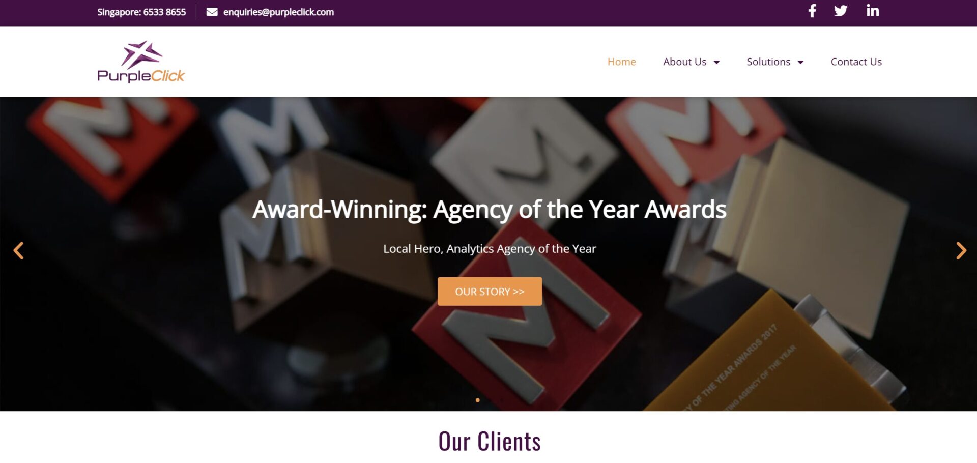 PurpleClick homepage featuring the headline Award-Winning: Agency of the Year Awards over a blurred background of various physical award trophies and an orange Our Story button.