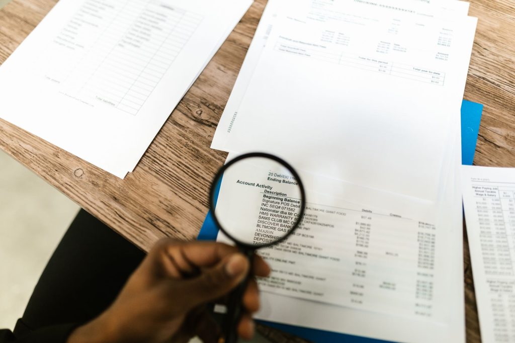 A professional conducting a diagnostic data audit on a digital interface during a preliminary review