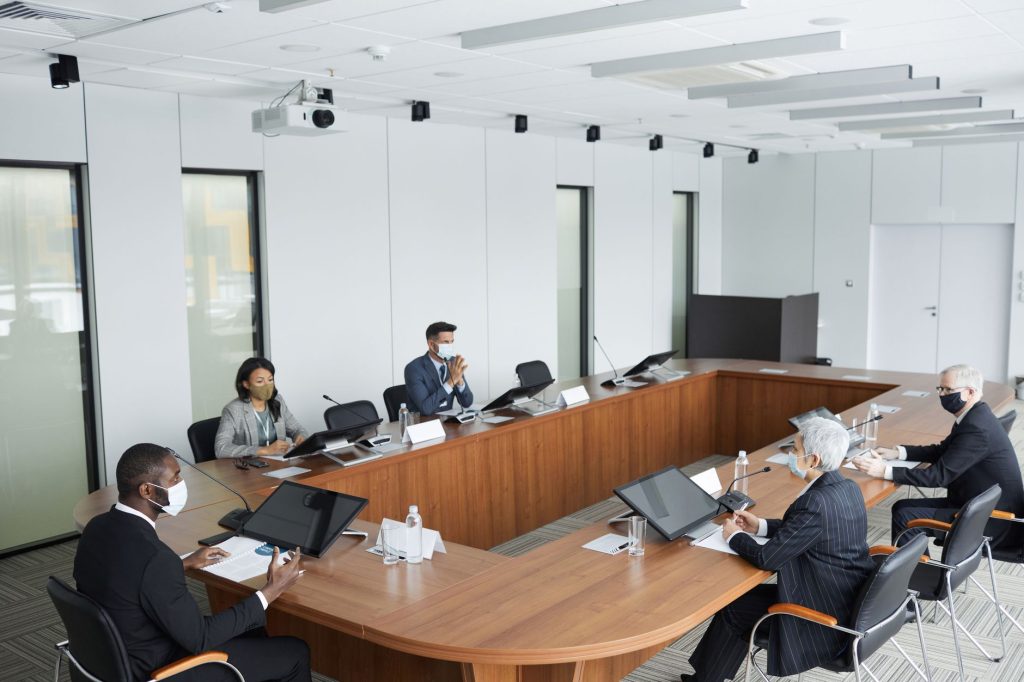Healthcare executives discussing commercial contracts