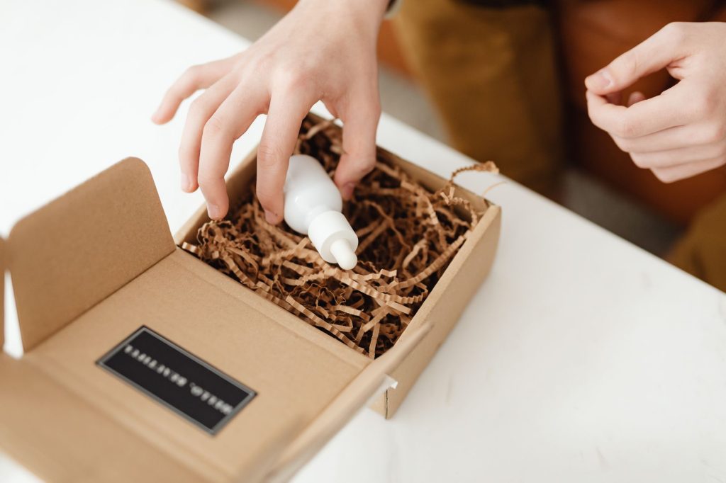 Executive opening a premium dimensional B2B direct mail package