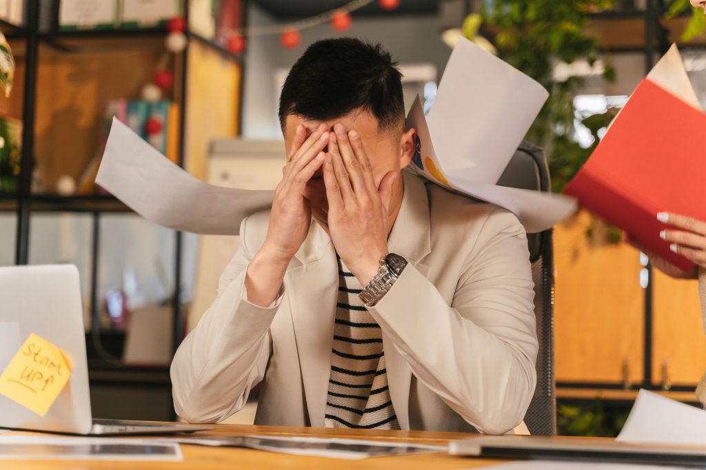 Business professional managing a crowded inbox and screening calls