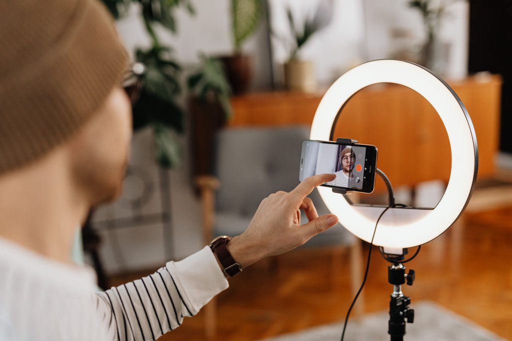 Content creator filming short-form video for social channels in a studio