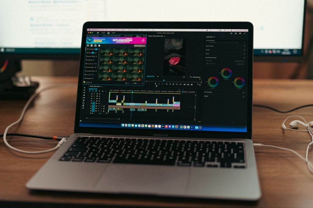 Video editor producing long-form video content on dual monitors