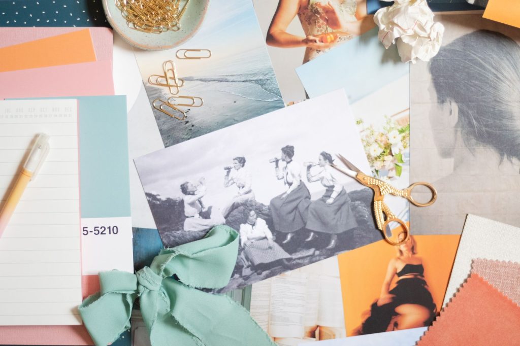 Creative designer organizing visual lifestyle moodboard and product samples
