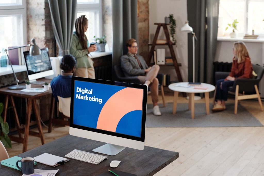 Agency team reviewing client social media strategy together at a workstation