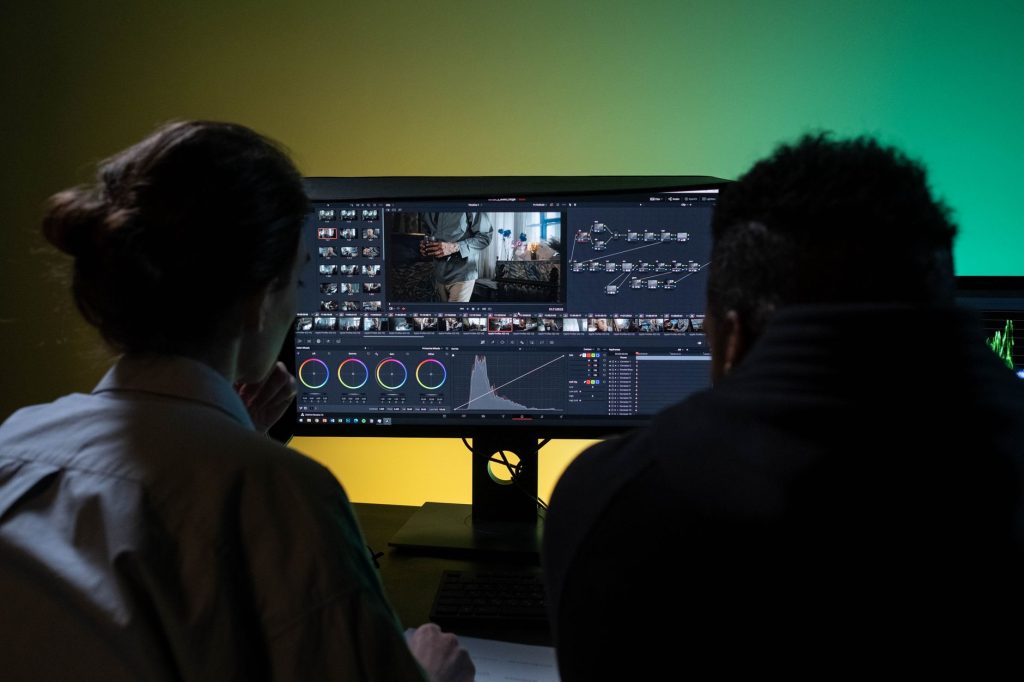 Video editor cutting short-form social clips on desktop editing software