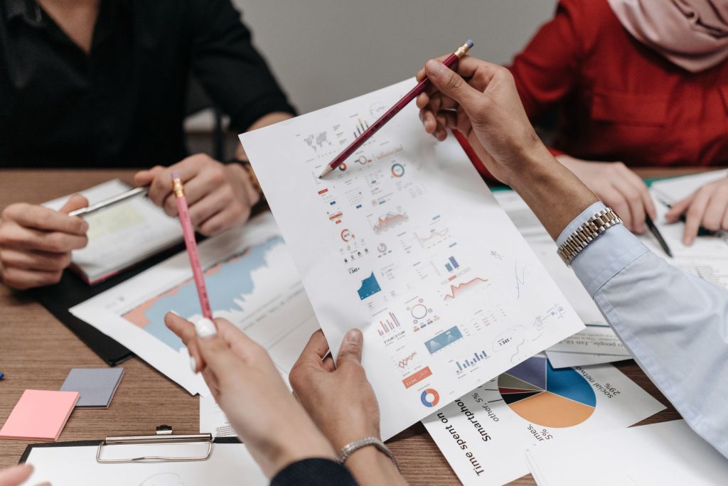 Marketing professionals reviewing brand guidelines and data security compliance
