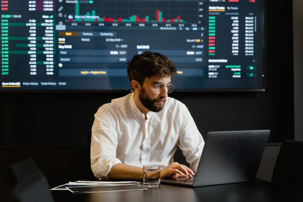Digital marketer analyzing attribution and search traffic metrics on a monitor