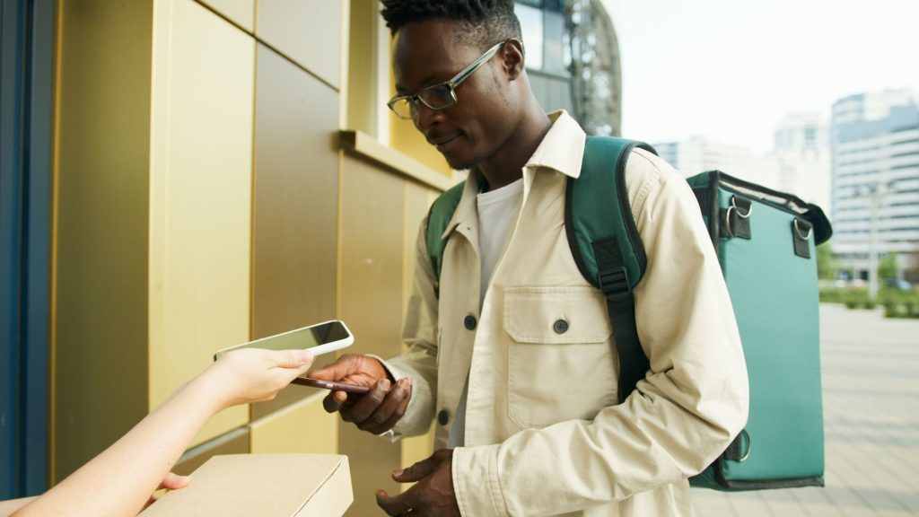 A person checking a relevant mobile message while out and about.