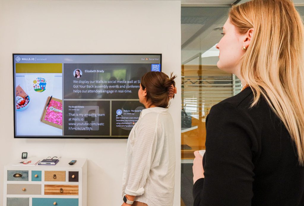 A team accesses customer media from a shared digital asset system.