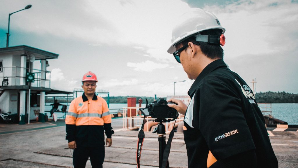 A construction team recording a project walkthrough for social media