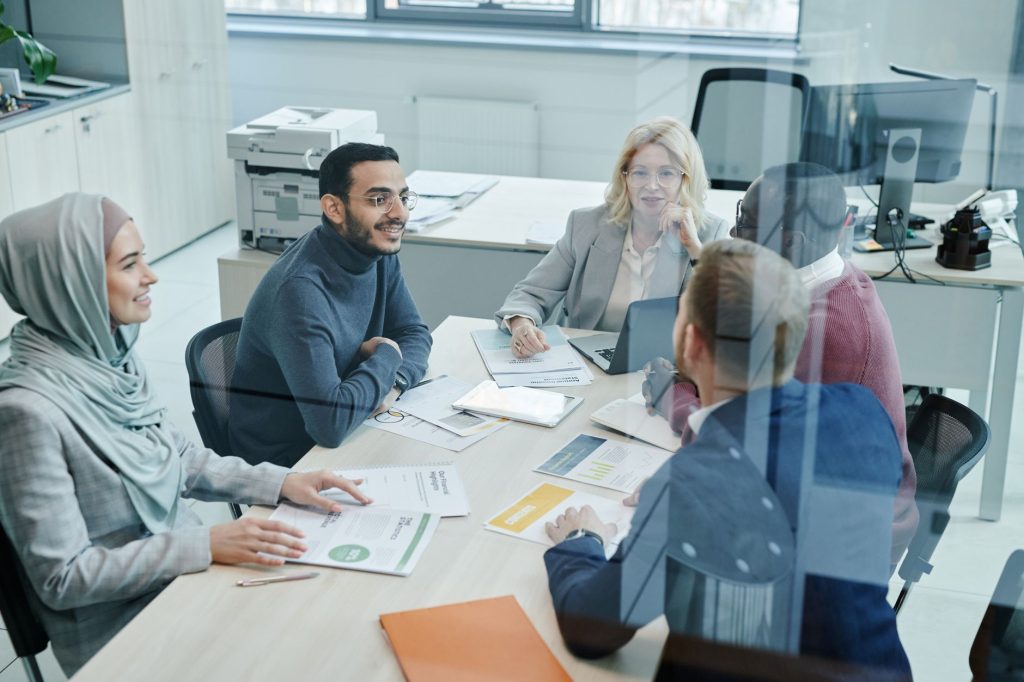 Marketing, sales, and product colleagues sharing customer insights