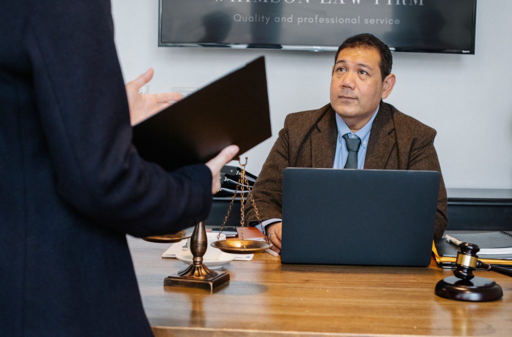 A law firm team reviews inquiries, consultations, and financial results.
