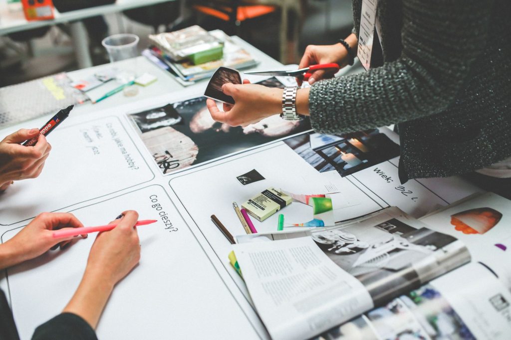 A social media agency team discusses campaign strategy with a client.